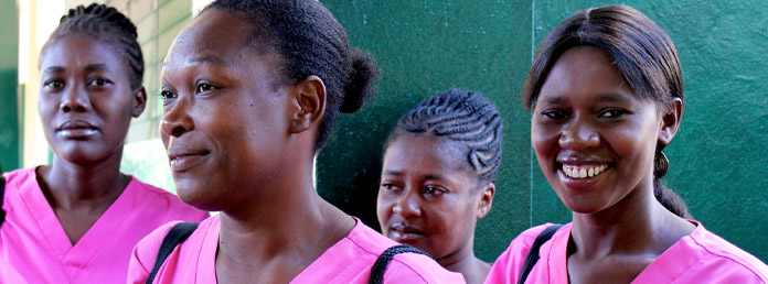 four midwives in pink scrubs