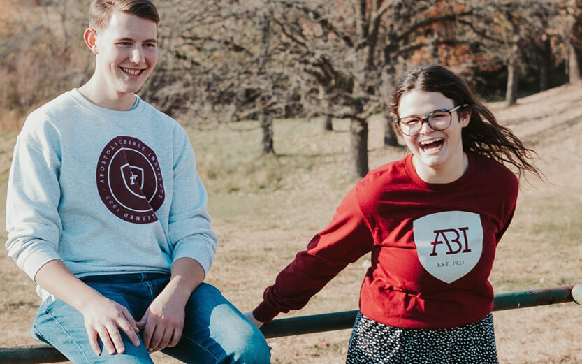 male and female students wearing ABI sweatshirts