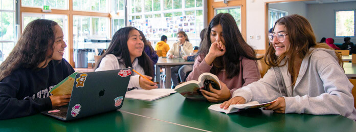 four students studying together