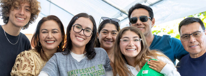 a group of students and teachers smiling