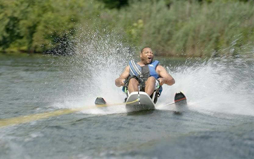 man having fun on special water skis