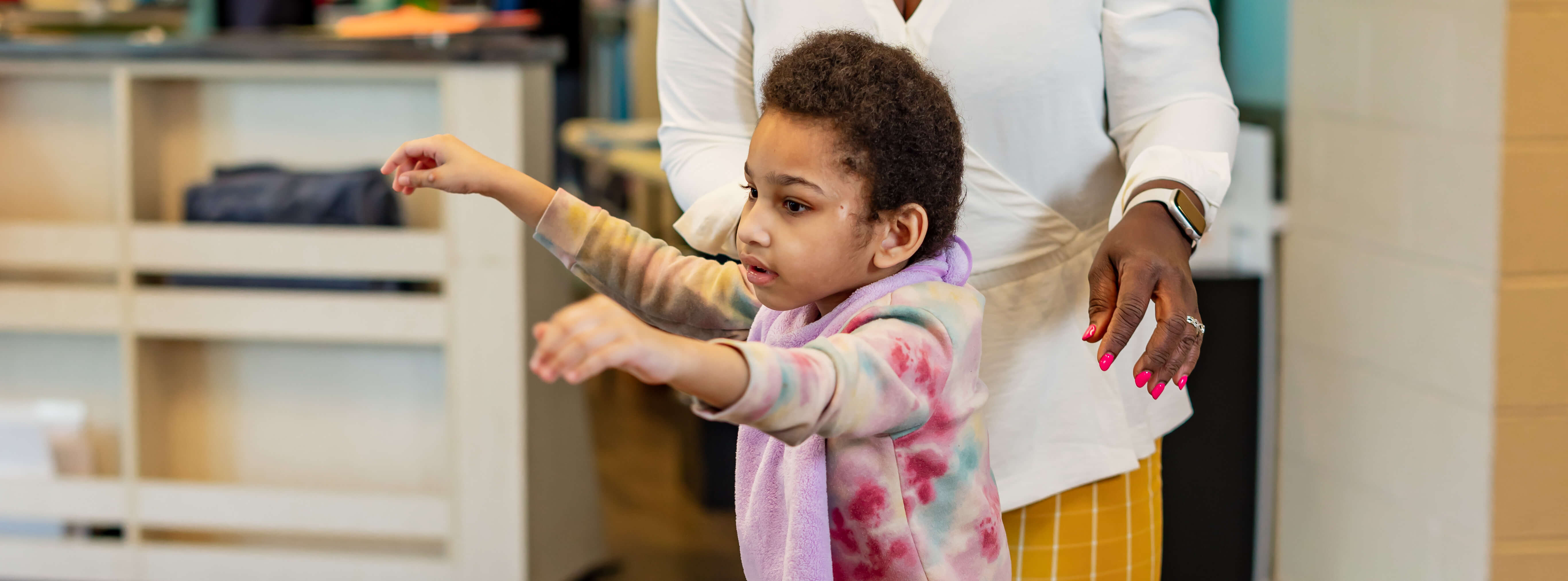 young girl with outstretched arms