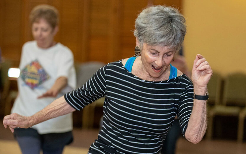 a senior woman taking an aerobics class