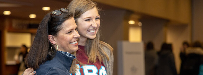 collegian and alum smiling