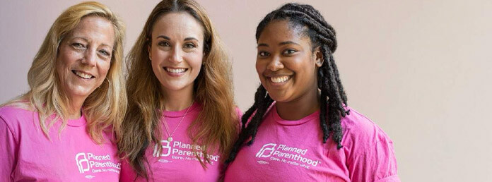 a group of three Planned Parenthood volunteers smiling