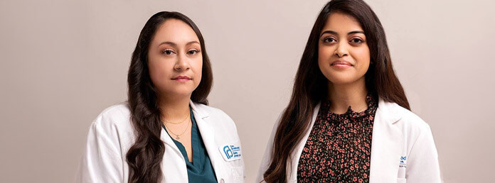 two Planned Parenthood doctors pose for a photo