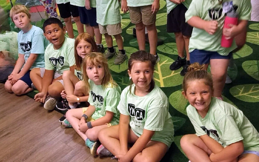 a group of young campers with YWCA t-shirts