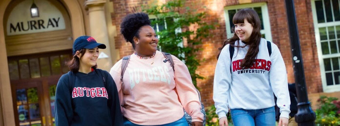 three Rutgers students wearing school sweatshirts