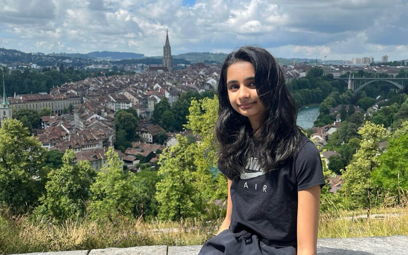 a teen girl with Bern Switzerland in the background