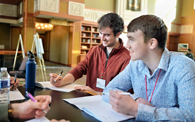 two male students in a study hall