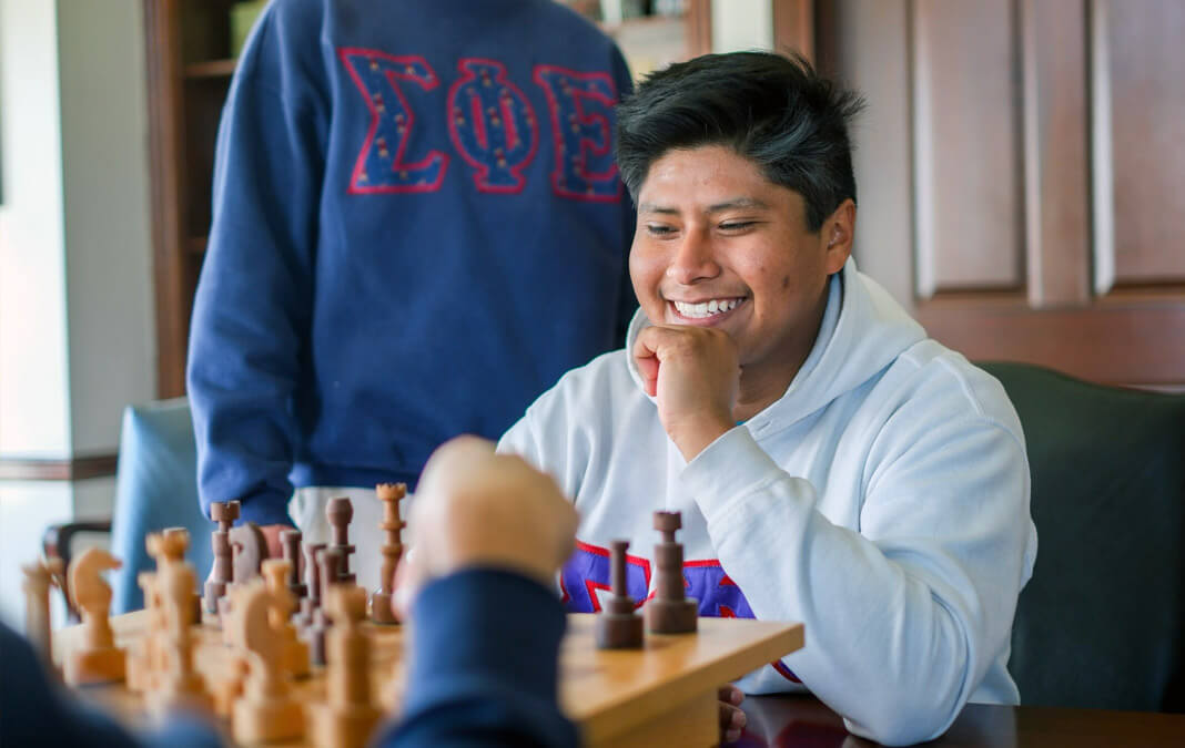 Sigma Phi Epsilon members playing chess