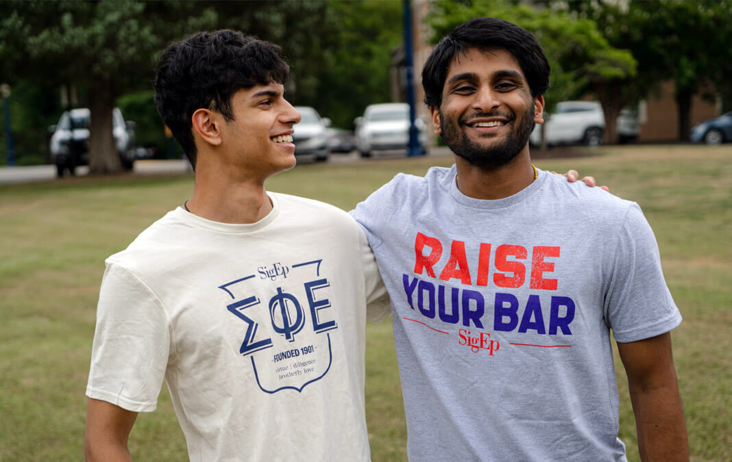 two men wearing SigEp tshirts