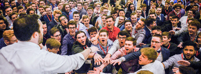 group of sig ep students with hands in