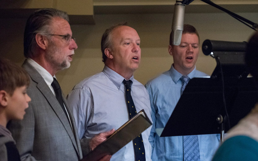 men singing in a choir