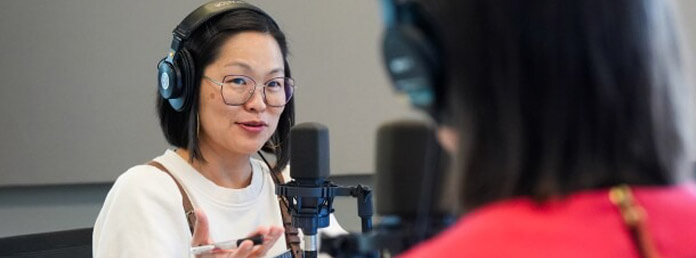 a woman interviewing another woman