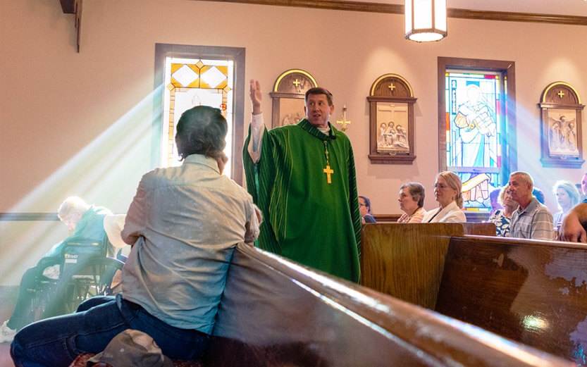 the bishop wearing a green robe