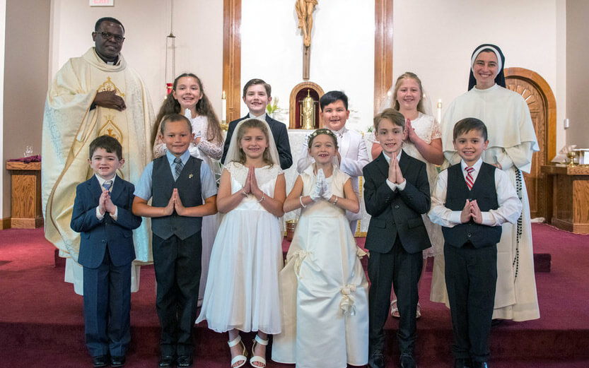 a group shot of children after a ceremony