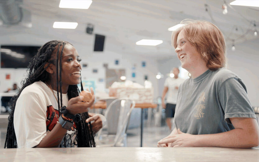 a mentor talking with a teen girl