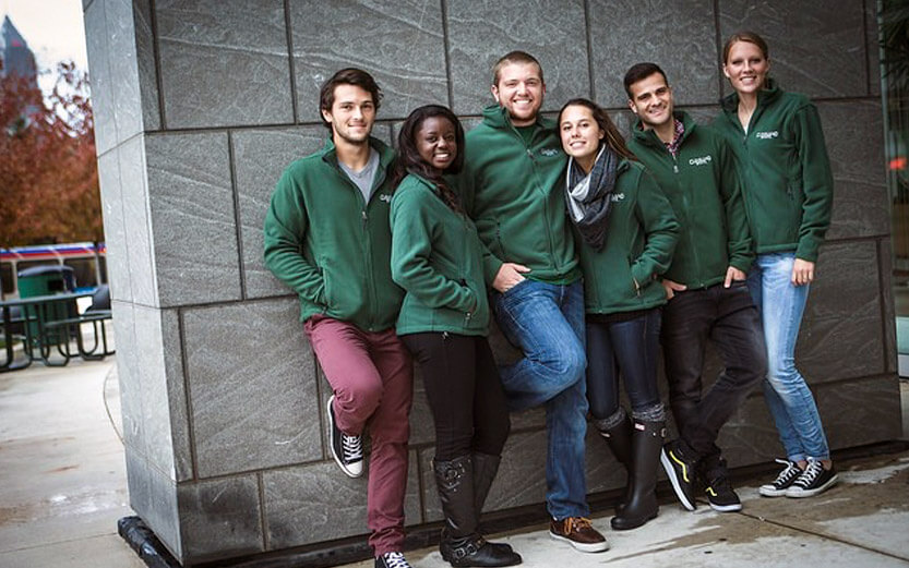 a group of students wearing green CSU jackets