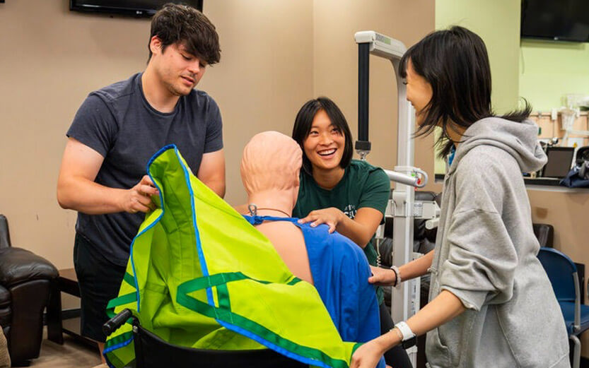 med students working with a dummy