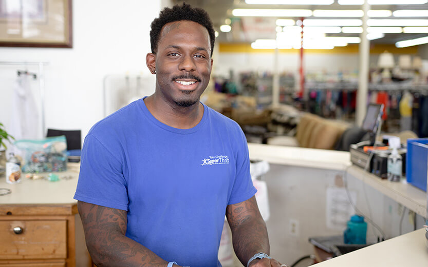 Young man working behind a counter