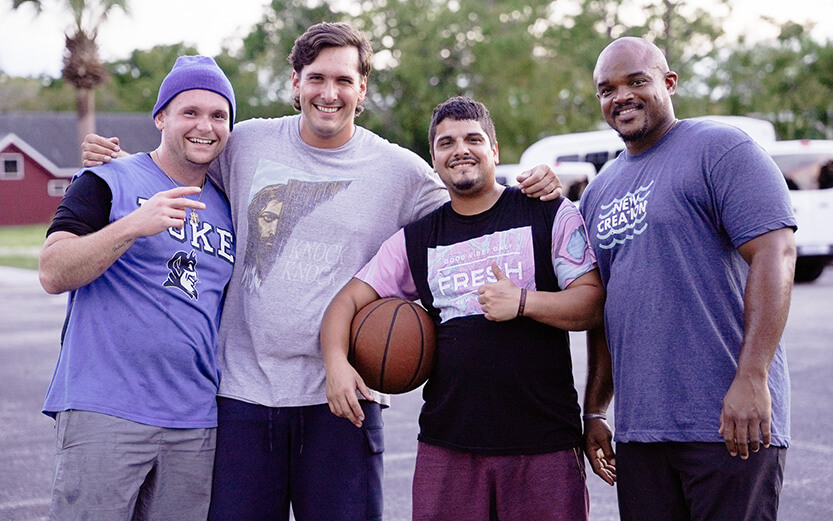 Basketball players posing for a photo
