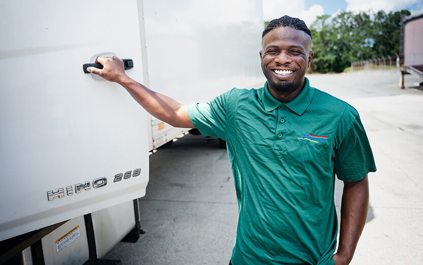Man opening trailer door