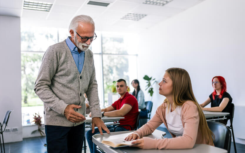a senior teacher talking to a student