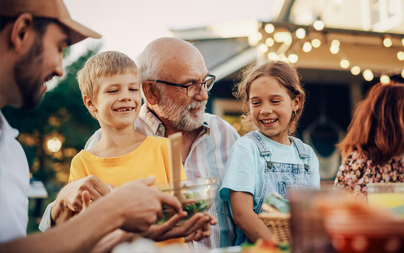 a family having a meal outdoors