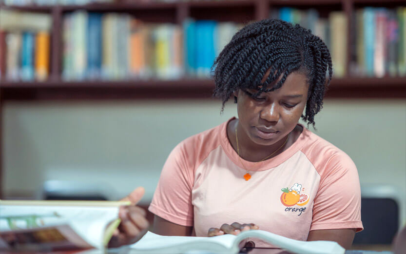 student studying in a library