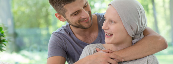 a man with his arms around a woman wearing a head scarf