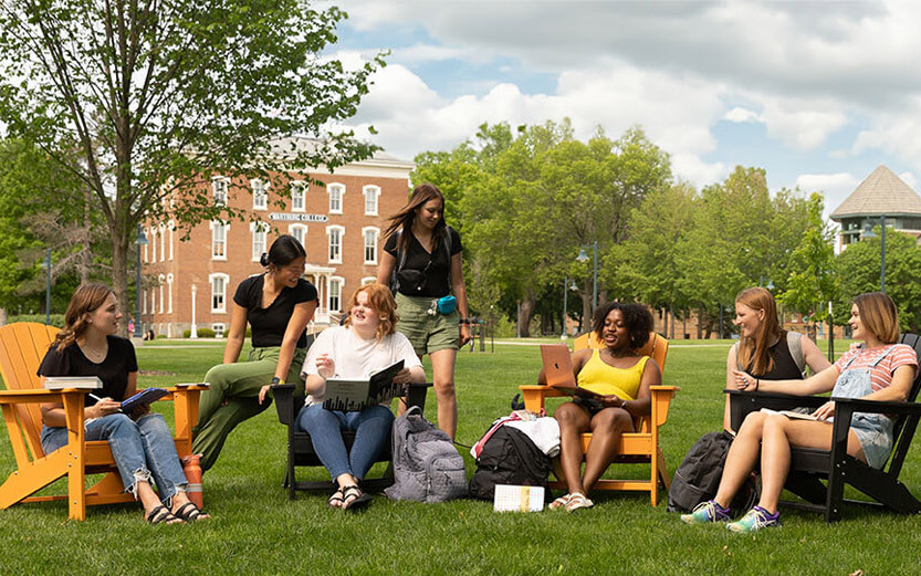 students socializing on school lawn