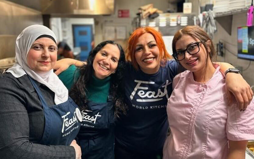 four women training in a kitchen