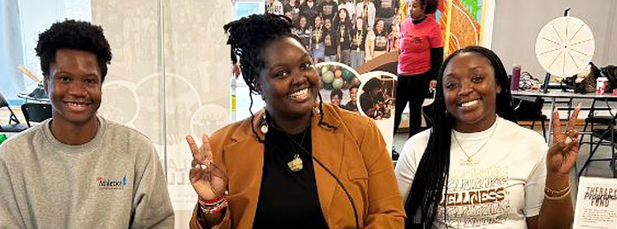 three mental health workers smiling