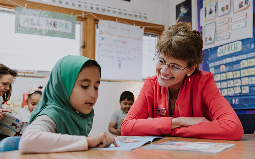 teacher helping student