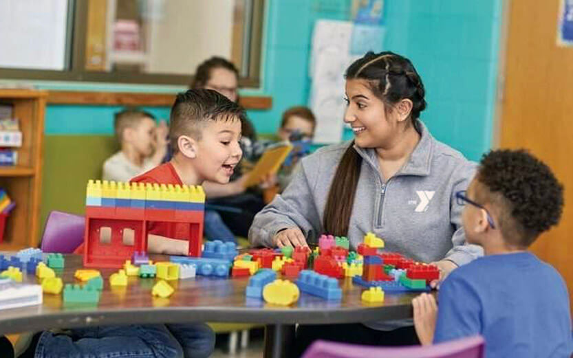 a child care worker playing with kids
